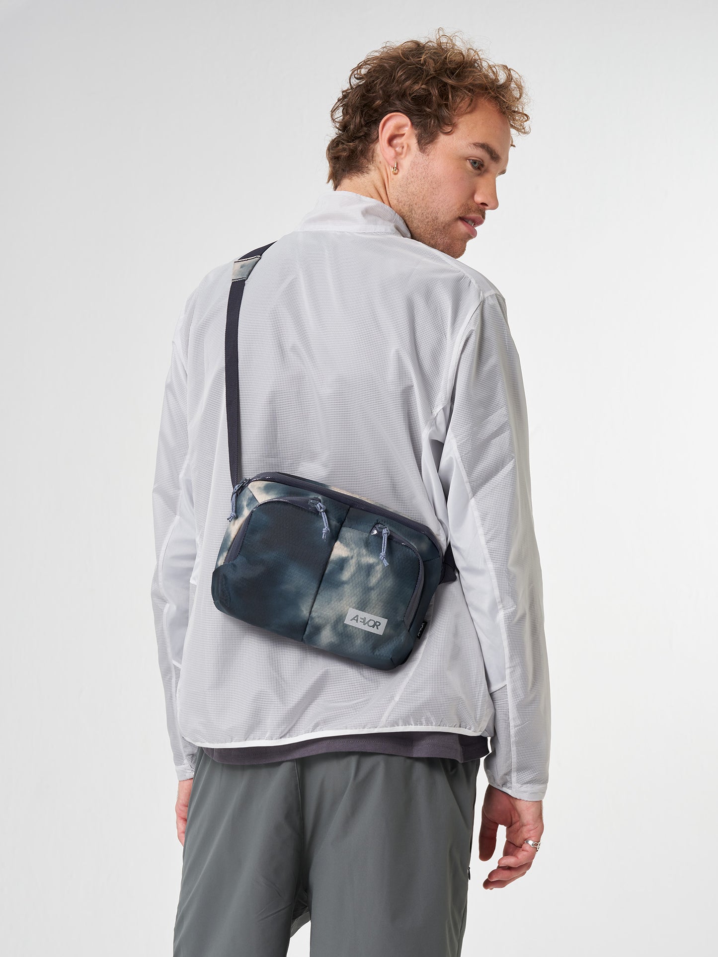 AEVOR-Sacoche-Bag-Proof-Tie-Dye-model-front