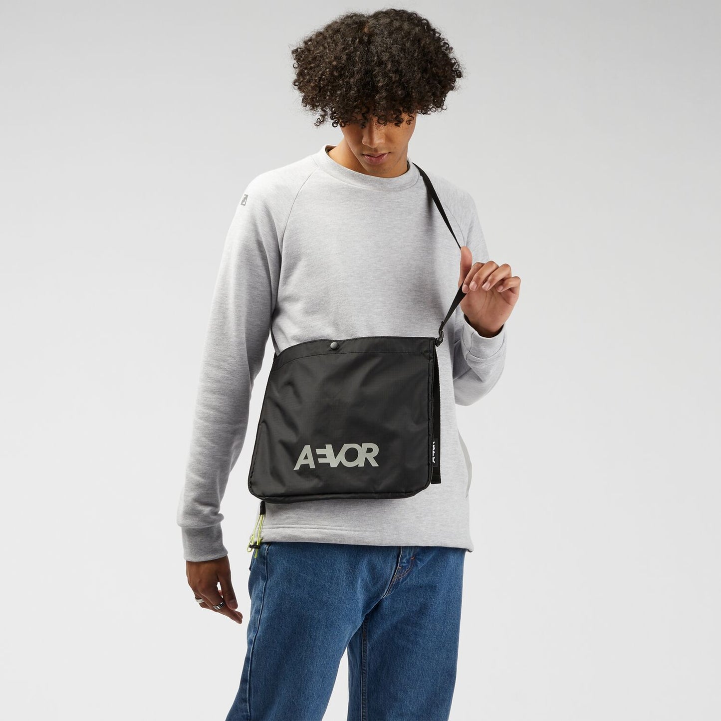 AEVOR-chest-bag-Mussette-Ripstop-Black-model-front